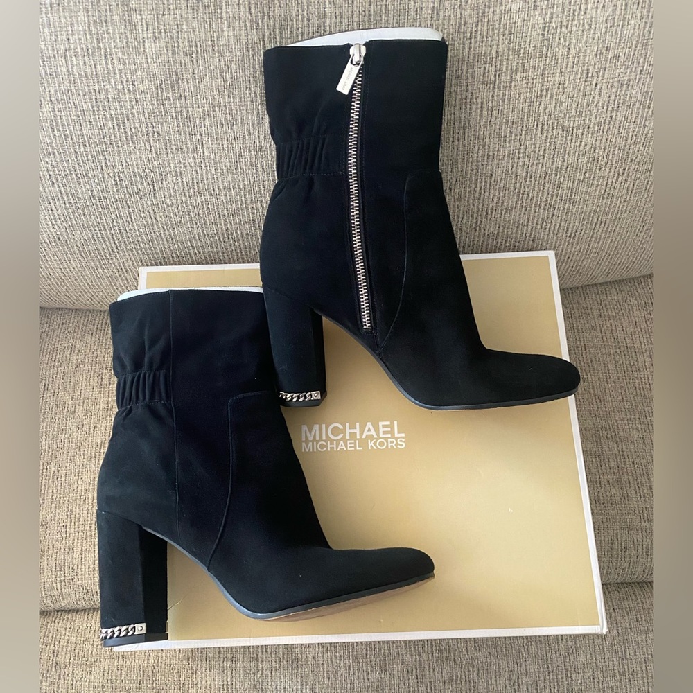 Michael Kors feature block heel accented with metallic chain and logo detailing